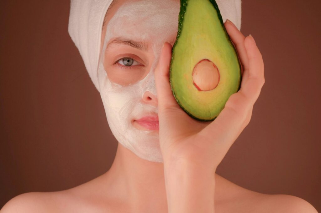Woman with a white face mask, evoking skincare and beauty routines