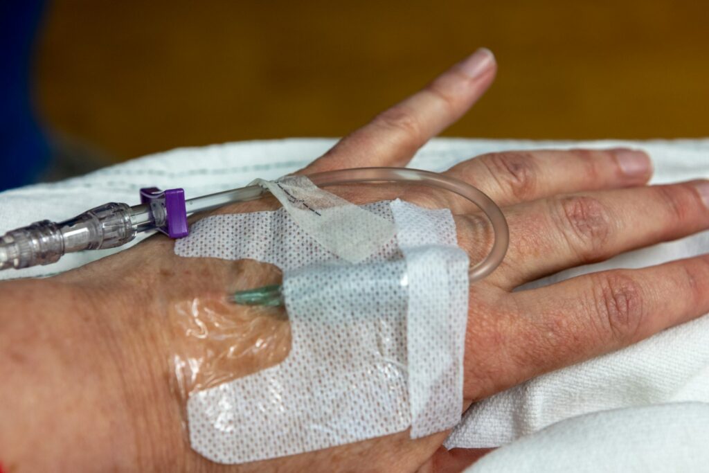 IV line placed by a clinician, illustrating the IV route for B12 delivery